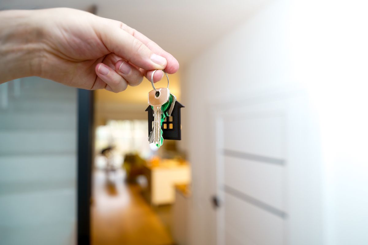 Property manager holding keys to a Florida rental apartment